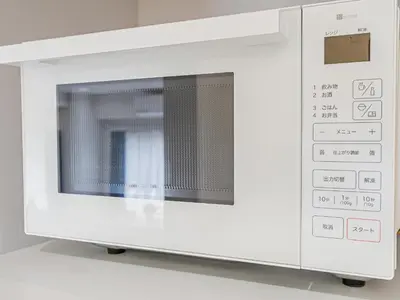 a white microwave oven on a white table at phoneix apt ginza in Tokyo
