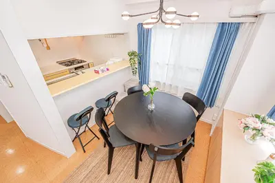 a kitchen and dining room with a table and chairs at phoneix apt ginza in Tokyo