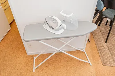 a small table with a pair of shoes on it at phoneix apt ginza in Tokyo