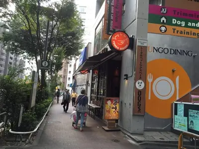 a group of people walking down a city street at \u897f\u65b0\u5bbf\u548c\u5eb5 wa-an homestay in Tokyo