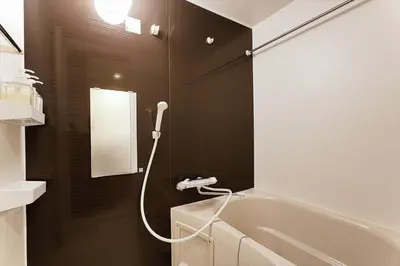a bathroom with a shower and a bath tub at Tomo House Yotsuya-Sanchome 101 - from 6 minutes station \u56db\u8c37\u4e09\u4e01\u76ee 101 \u99c5\u304b\u3089\u5f92\u6b696\u5206 in Tokyo
