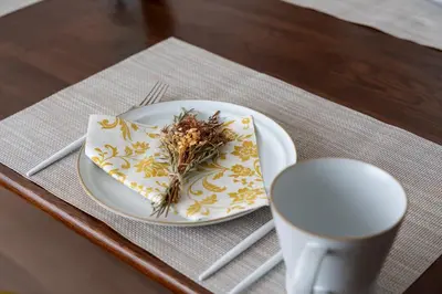 a plate with a napkin with flowers on it on a table at feel Shinjuku STAY in Tokyo
