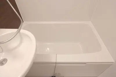 a bathroom with a white sink and a mirror at Senjushuku FUJI 101 \u5317\u5343\u4f4f in Tokyo