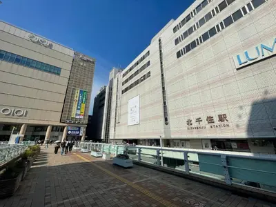 a large building with people walking in front of it at Senjushuku FUJI 101 \u5317\u5343\u4f4f in Tokyo