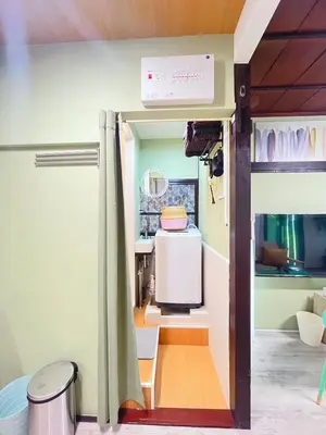 a small room with a kitchen with a tv at Nakakasai Kodate NKK21 in Tokyo