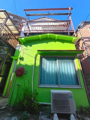 a green building with a window on the side of it at Nakakasai Kodate NKK21 in Tokyo