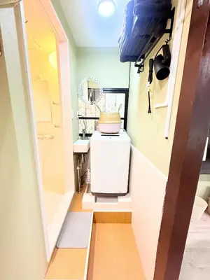a small kitchen with a refrigerator in a room at Nakakasai Kodate NKK21 in Tokyo