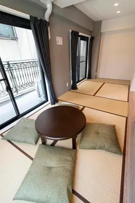 a room with a table and some windows at VOERE亀戸 - Kameido Modern Suite - Direct to Akihabara & Shinjuku - Near Asakusa, Skytree in Tokyo