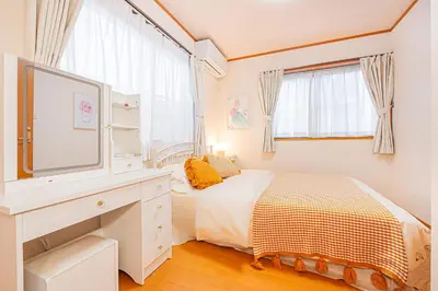 a white bedroom with a bed and a tv at Higashi koiwa 4 Bed rooms Villa 5 minutes walk from JR Koiwa station 60min friom Haneda airport in Tokyo