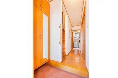 a hallway of a house with white walls and wooden floors at Higashi koiwa 4 Bed rooms Villa 5 minutes walk from JR Koiwa station 60min friom Haneda airport in Tokyo
