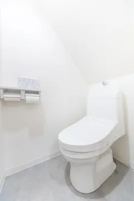 a white toilet in a bathroom with white walls at Witch's House Walk to Ikebukuro Tokyo's Ghibli Fairy Tale House in Tokyo