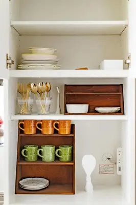 a cupboard filled with plates and bowls and dishes at Witch's House Walk to Ikebukuro Tokyo's Ghibli Fairy Tale House in Tokyo