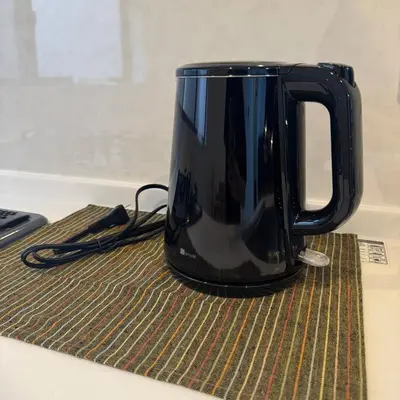 a black coffee pot sitting on a table at Entire House 3 Mins Walk from JR station - Family welcome in Tokyo
