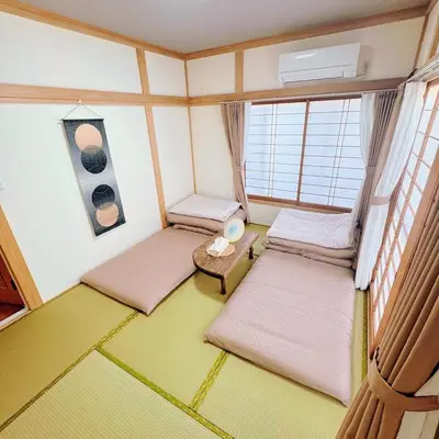 a small room with two beds and a table at Entire House 3 Mins Walk from JR station - Family welcome in Tokyo