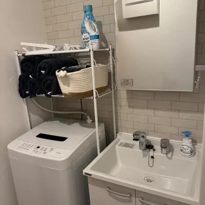 a bathroom with a washing machine and a sink at Entire House 3 Mins Walk from JR station - Family welcome in Tokyo