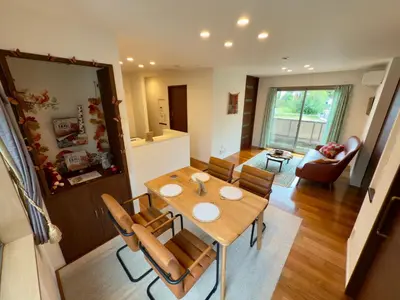 a dining room and living room with a table and chairs at Private stay, fully equipped 45 square meter, Easy access to Disneyland & Airports in Tokyo