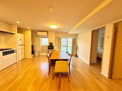 a kitchen and dining room with a table and chairs at \u5317\u6ca2\u611b\u306e\u65c5 in Tokyo