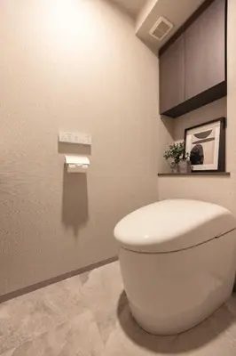 a bathroom with a white toilet in a room at Mocomoco House Azabu in Tokyo