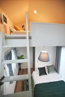 a room with two bunk beds and a bed at SG5371 Visit Shibuya Crossing! Walking distance to a single family home for 8 people, private parking , downstairs supermarket food Shibuya in Tokyo