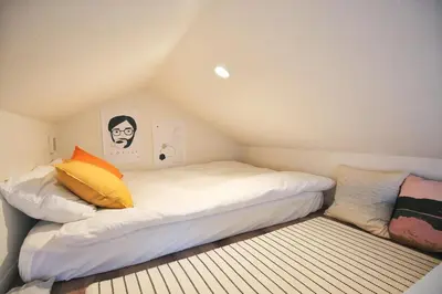 a small room with two beds in a attic at SG5371 Visit Shibuya Crossing! Walking distance to a single family home for 8 people, private parking , downstairs supermarket food Shibuya in Tokyo