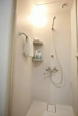a bathroom with a shower and a sink at BRT101 Ikebukuro Station , Double Apartment , Yamanote Line direct access to Shinjuku Shibuya, convenient transportation, fully equipped in Tokyo