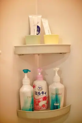 a shelf with three bottles of detergents on it at BRT103 Ikebukuro Station Double Apartment in a Busy Business District, Yamanote Line and 8 Subway Lines Direct to Shinjuku, Shibuya, Ginza, Akihabara, Fully Equipped in Tokyo