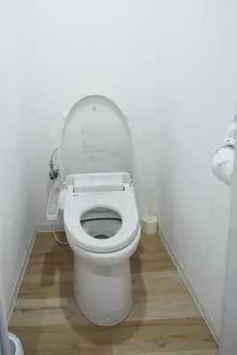 a bathroom with a toilet with the lid up at BRT203 Ikebukuro Station Double Apartment in a Busy Business District, Yamanote Line and 8 Subway Lines Direct to Shinjuku, Shibuya, Ginza, Akihabara, Fully Equipped in Tokyo