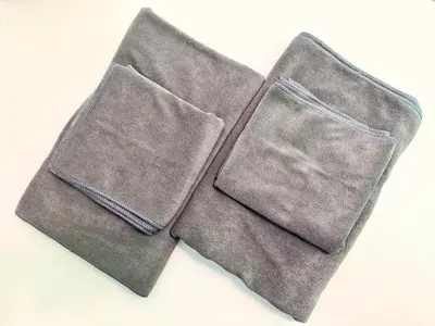 two brown napkins sitting on top of a table at torico takinogawa in Tokyo
