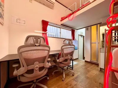 a office with two chairs and a desk in a room at torico takinogawa in Tokyo
