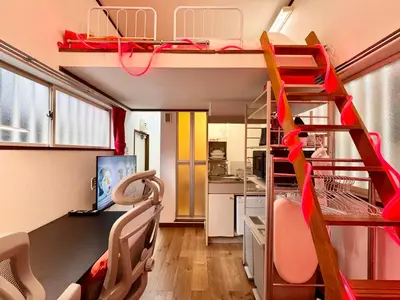 a room with two bunk beds and a kitchen at torico takinogawa in Tokyo