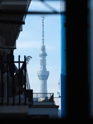 a view of the eiffel tower through a window at Monzen-Nakacho Stylish 1LDK with 2 Double Beds in Tokyo