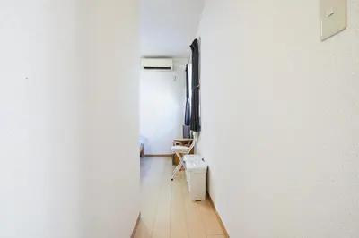 a hallway with a white wall and a toilet at 102 Nishi-Shinjuku 5-chome MRT station 5 minutes on foot in Tokyo
