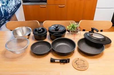 a group of pans and utensils on a table at Senjushuku FUJI 201 \u5317\u5343\u4f4f in Tokyo