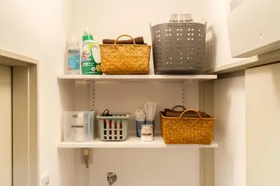 a bathroom shelf with baskets and utensils at Senjushuku FUJI 201 \u5317\u5343\u4f4f in Tokyo