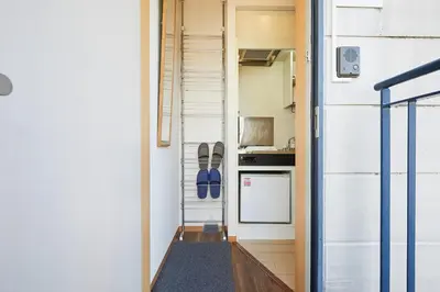 a tiny house with a kitchen and a hallway at 302 Nishi-Shinjuku-Gochome Station 5 minutes on foot in Tokyo