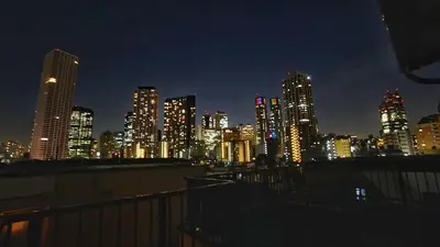 a view of a city skyline at night at 103 3-minute walk to Nishi-Shinjuku 5-chome Station in Tokyo