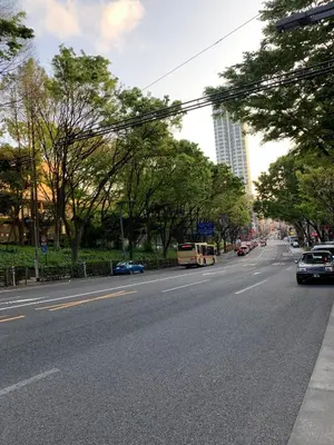 a street with cars driving down a city street at Shibuya Star 101 4 mins to Shinjuku Free WiFi in Tokyo