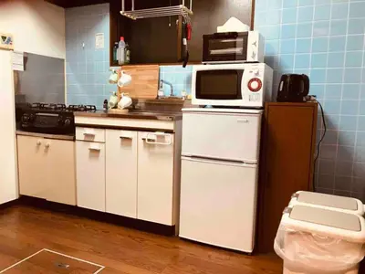 a kitchen with white appliances and blue tiles at Shibuya Star 101 4 mins to Shinjuku Free WiFi in Tokyo