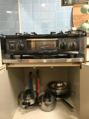 a kitchen with a toaster oven and pots and pans at Shibuya Star 101 4 mins to Shinjuku Free WiFi in Tokyo