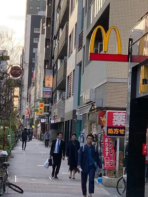 a group of people walking down a city street at Shibuya Star 102-4 mins to Shinjuku-Free WiFi in Tokyo