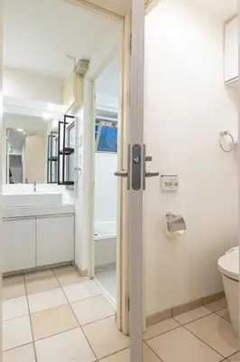 a bathroom with a tub and a toilet and a sink at JR LINE Neko and Mado in Tokyo