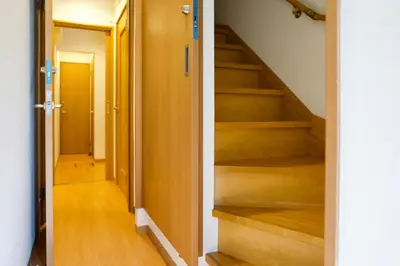 a hallway with stairs in a house at Ueno Hoshi-5 minutes from Iriya Station-1 stop from Ueno station in Tokyo