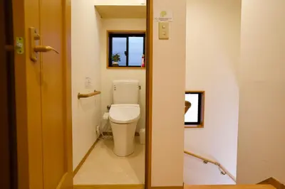 a bathroom with a toilet and a window at Ueno Hoshi-5 minutes from Iriya Station-1 stop from Ueno station in Tokyo