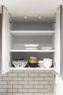 a cupboard with plates and bowls in it at JR Line yamanote ikebukuro in Tokyo