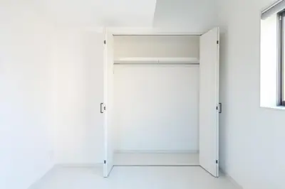 an open white door in a white room at JR Line yamanote ikebukuro in Tokyo