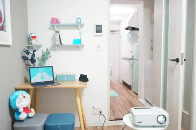 a room with a desk with a laptop on it at 2 beds near Higashinakano st. 5 min to Shinjuku in Tokyo