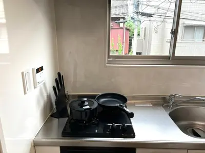 a pot on a stove in a kitchen with a window at Ikebukuro Area 2F5 NishiikeApartment in Tokyo