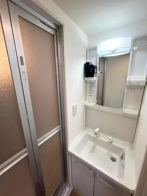 a bathroom with a sink and a mirror at Ikebukuro Area 2F5 NishiikeApartment in Tokyo