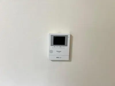 a white microwave hanging on a wall at Ikebukuro Area 2F5 NishiikeApartment in Tokyo