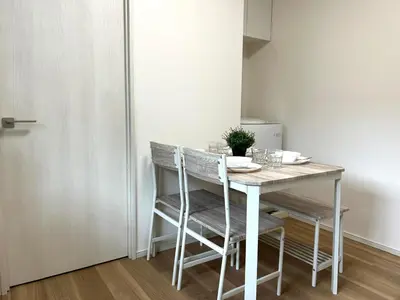 a dining room table and chairs in a room at Ikebukuro Area 2F5 NishiikeApartment in Tokyo